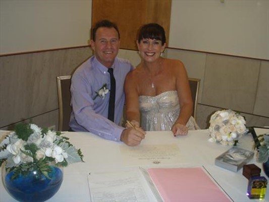 Darwin Skycity Casino Wedding - Mark & Paula signing making it legal
